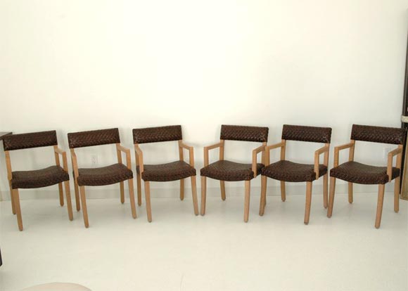 A rare set of 6 armchairs designed by Billy Haines for Ann and Jack Warner, these chairs feature Cerused Oak frames with woven Leather seats and backs.